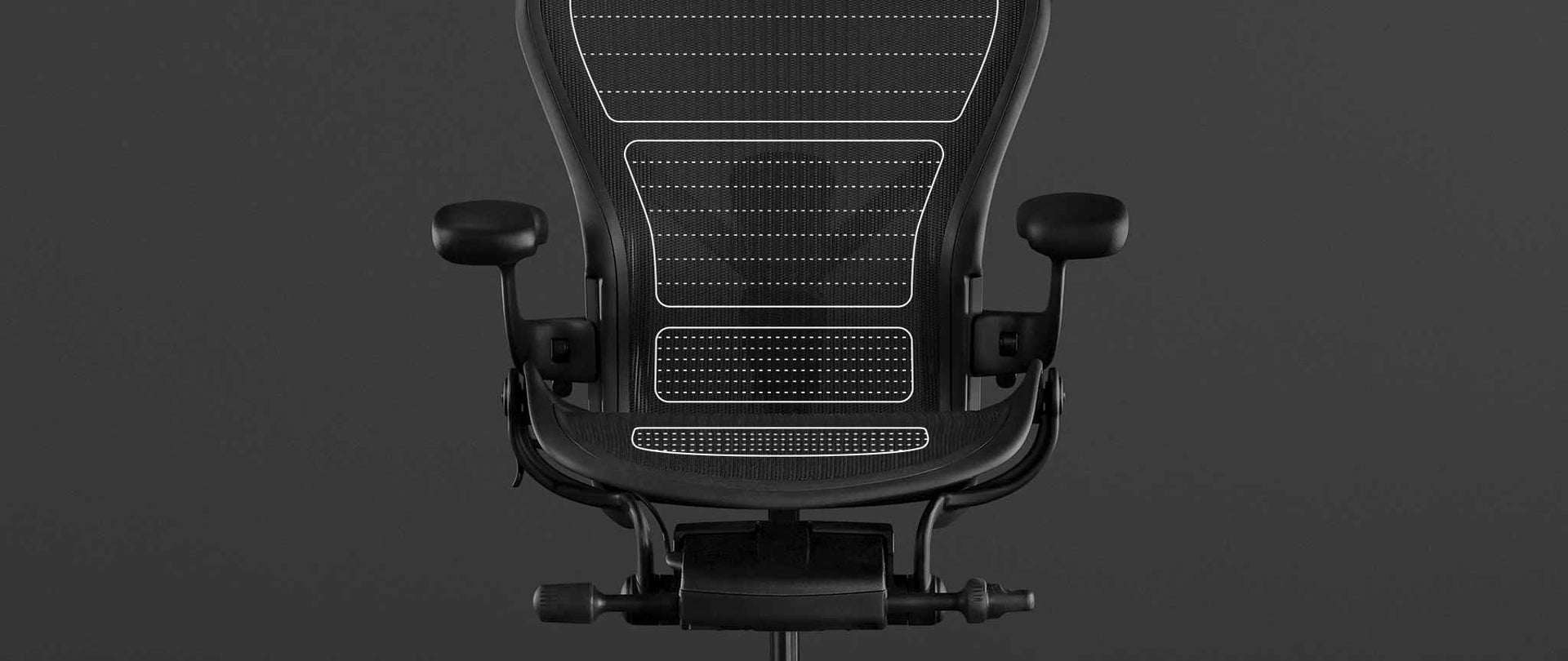 Vista dei caratteri di una sedia da gioco Aeron nera di Herman Miller, sovrapposta alla grafica bianca che evidenzia il materiale 8Z Pillicle.