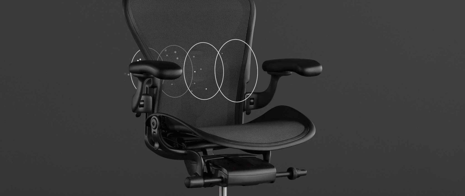 Vista dei caratteri di una sedia da gioco Aeron nera di Herman Miller, sovrapposta alla grafica bianca che evidenzia il materiale 8Z Pillicle.